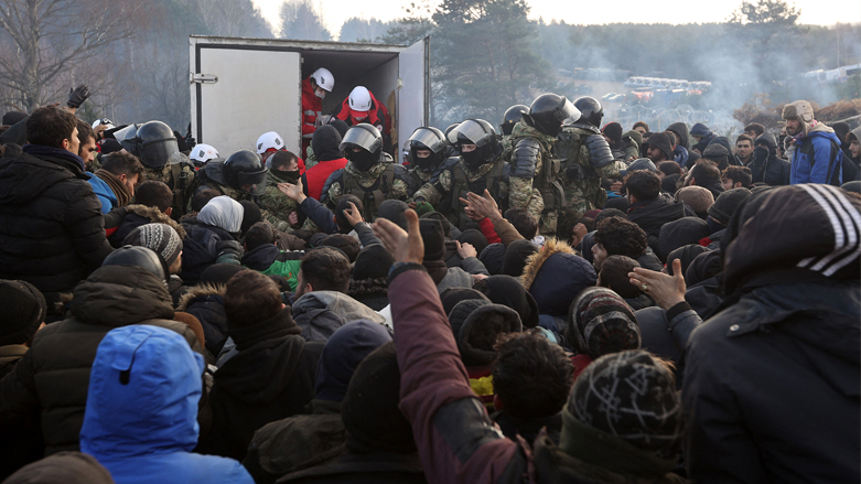 Migrants gather to receive humanitarian aid in a camp on the Belarus-Poland border, November 12, 2021. (Photo: Ramil Nasibulin Belta/AFP)